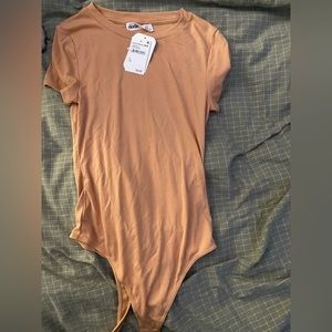 Elodie body suit. New with tags.